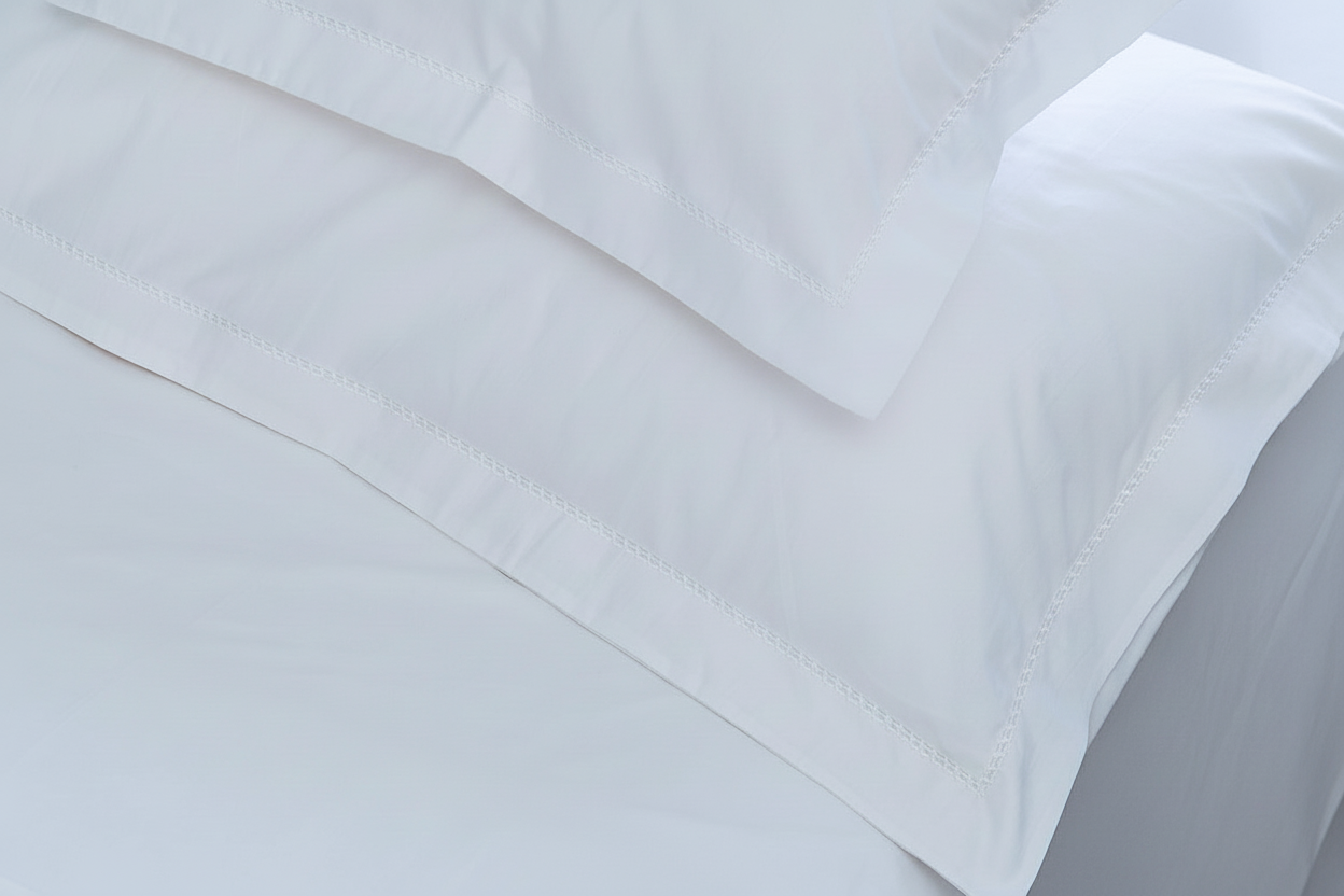 Bright white bedding with white trim